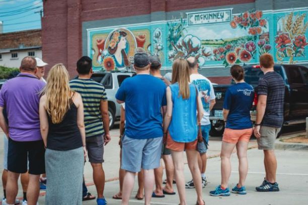 a group of people walking down a street