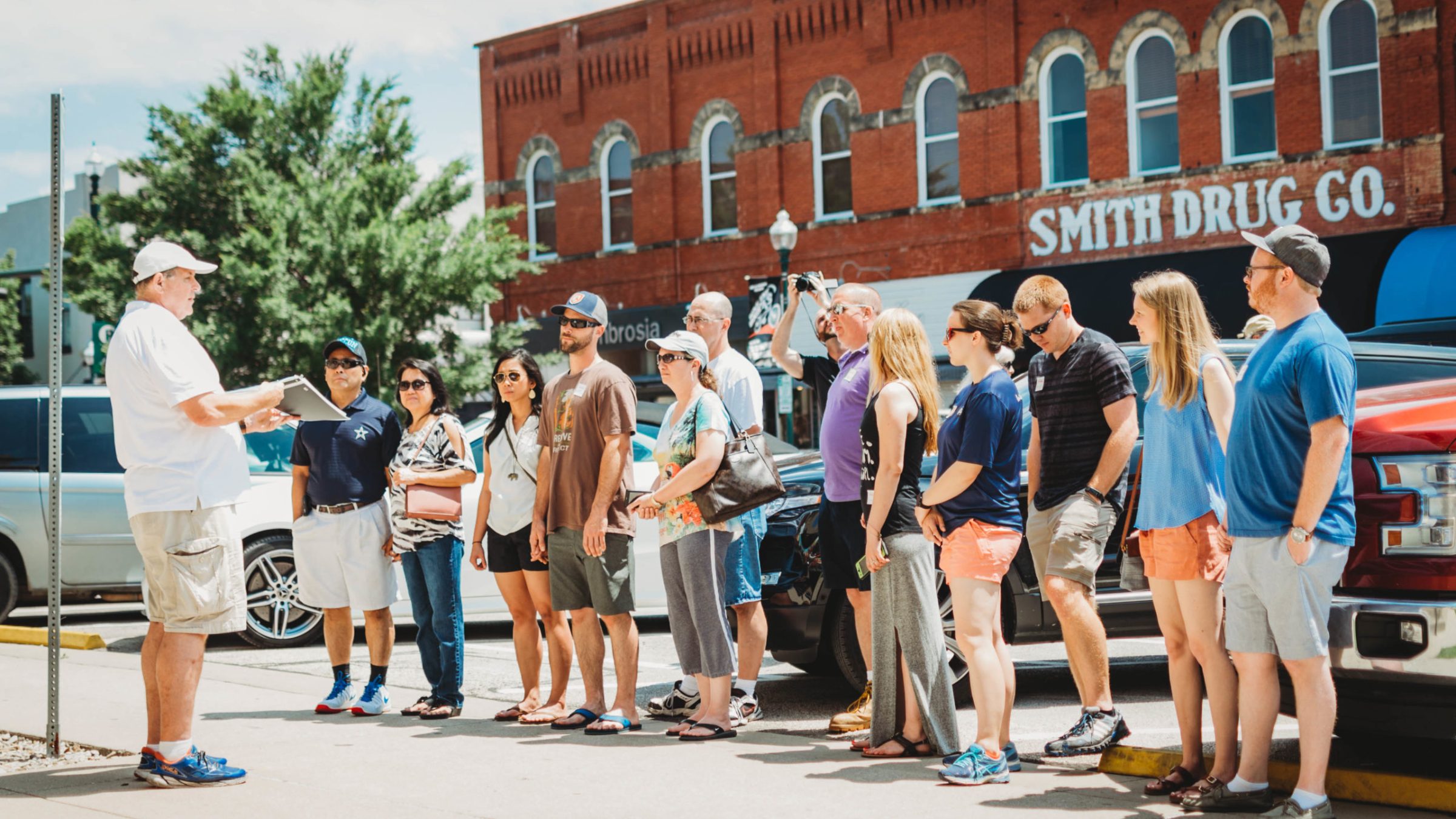 a group of people standing in front of a building