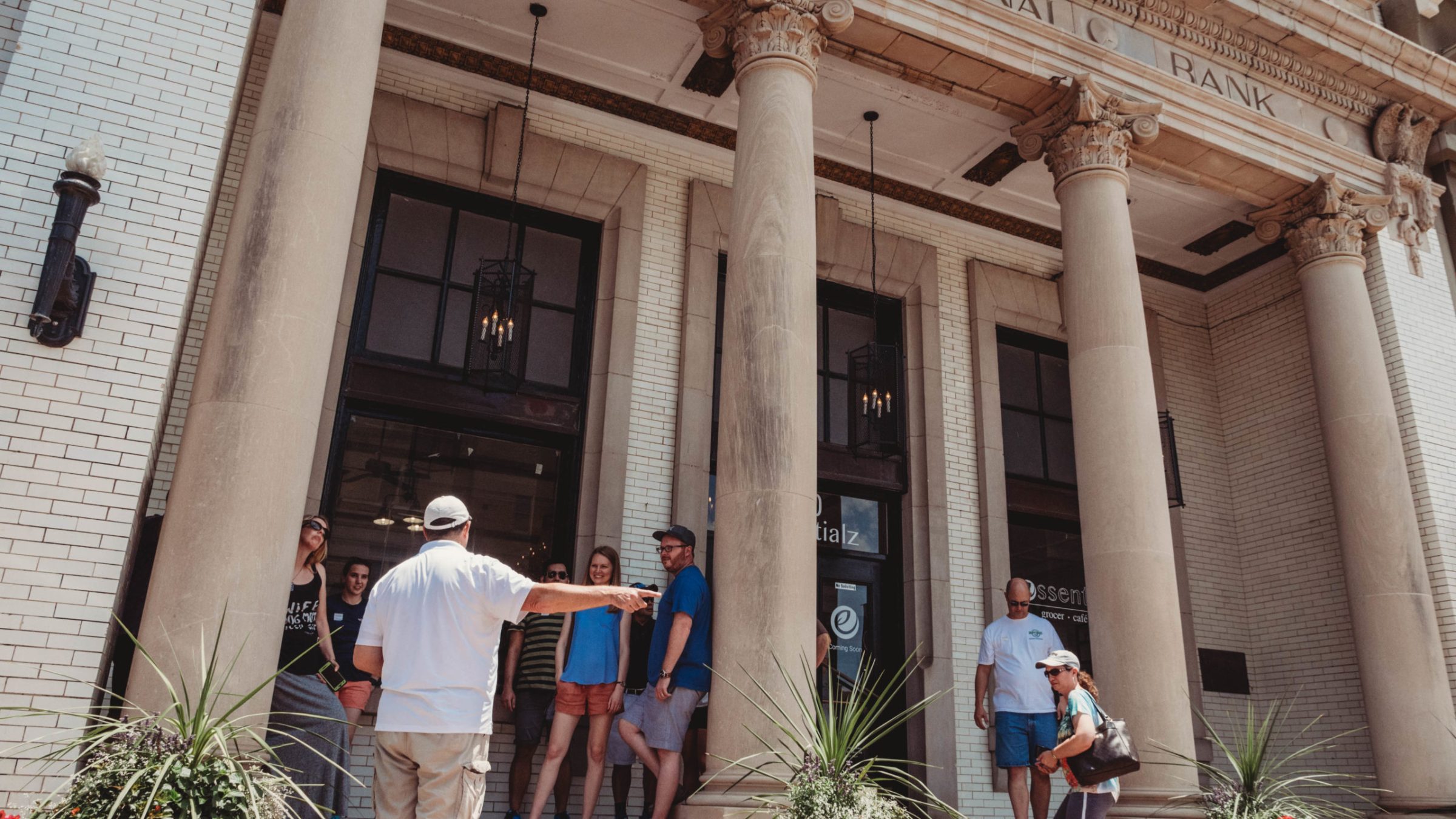 a group of people standing in front of a building