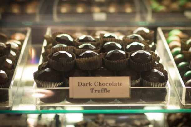 a display in a store filled with lots of different types of chocolate