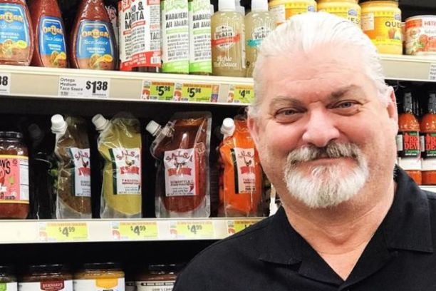 a man standing in front of a store