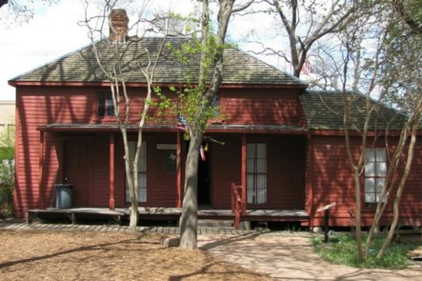 a house with trees in the background